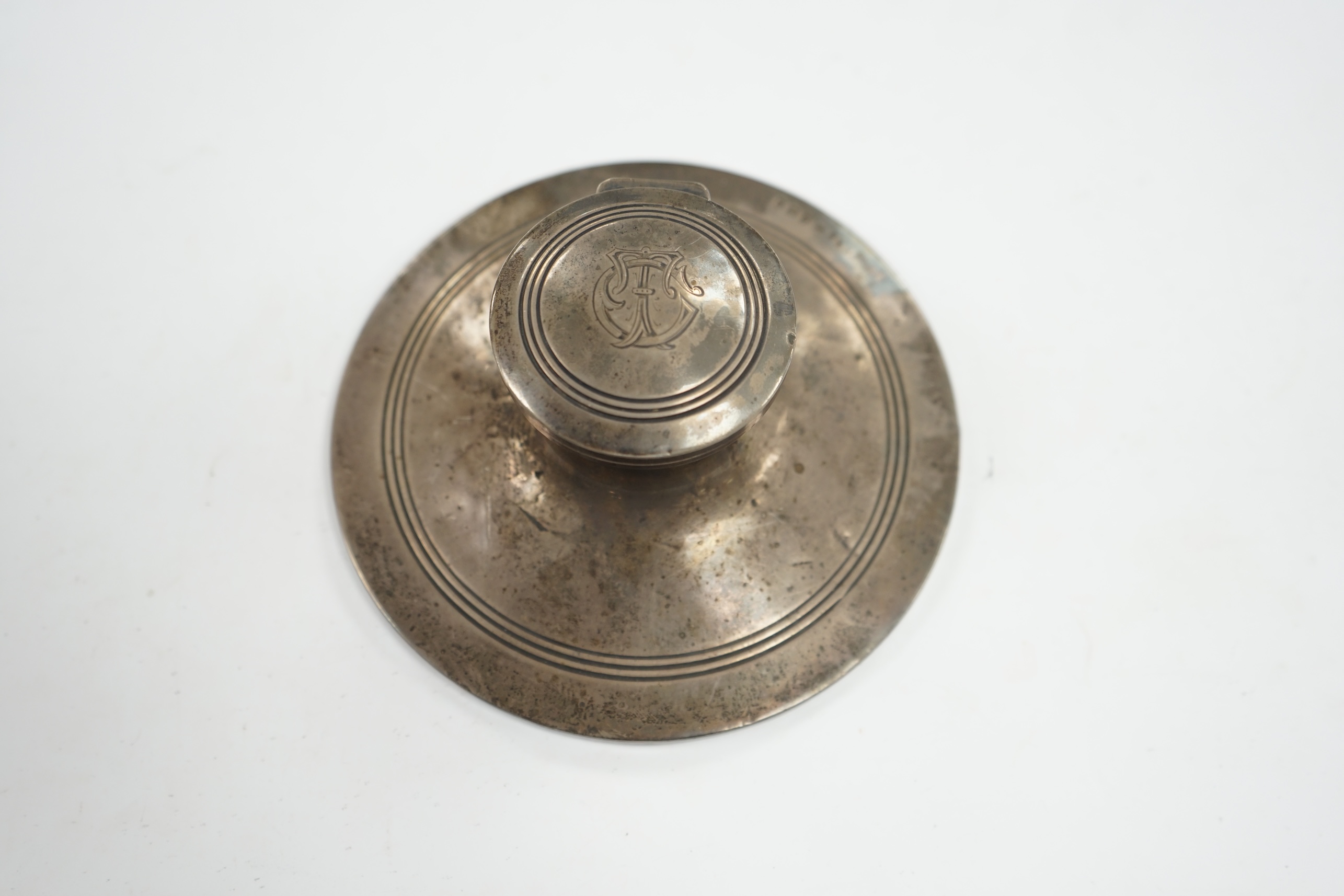 A George V silver mounted capstan inkwell, Birmingham, 1910, base diameter 15.2cm. Condition - poor to fair